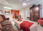 Thumbnail 10 of 34 - a living room with a couch and a chair at Arbors at Windsor Lake, Columbia  