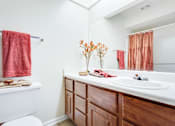 Thumbnail 17 of 34 - a bathroom with a toilet sink and bathtub at Arbors at Windsor Lake, South Carolina   