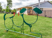 Thumbnail 4 of 17 - a playground in a park with a house in the background at The Bristol Apartments, Greenville, SC, 29601