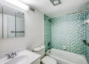 Thumbnail 4 of 23 - a bathroom with a sink toilet and bathtub
