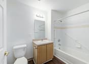Thumbnail 6 of 10 - a bathroom with a toilet sink and shower at Carolina Springs Apartments, Carrboro 