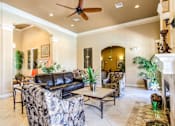 Thumbnail 5 of 6 - a living room filled with furniture and a ceiling fan