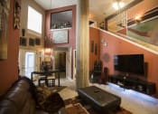 Thumbnail 1 of 18 - a living room filled with furniture and a flat screen tv