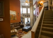 Thumbnail 3 of 18 - a view from the bottom of the stairs looking into the living room