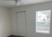 Thumbnail 7 of 15 - an empty room with a door and a window