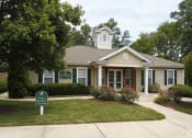 Thumbnail 13 of 15 - a house with a green sign in front of it