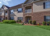 Thumbnail 3 of 31 - front view of an apartment building with green grass at Carrington Place at Wildewood, Columbia  