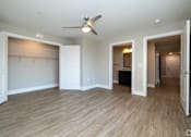 Thumbnail 7 of 23 - A room with a ceiling fan and wooden flooring at Dunean Creek Apartments, South Carolina