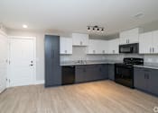 Thumbnail 1 of 23 - A kitchen with white cabinets and black appliances at Dunean Creek Apartments, Greenville, South Carolina