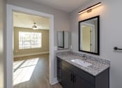 Thumbnail 10 of 23 - A bathroom with a sink, mirror, and a window at Dunean Creek Apartments, Greenville, SC