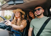Thumbnail 6 of 16 - a group of people in a car