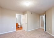 Thumbnail 5 of 11 - A room with a carpeted floor and a toilet in the corner at Lakeside Gardens Apartments, Durham, NC, 27713