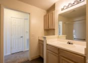 Thumbnail 13 of 28 - the preserve at ballantyne commons apartments bathroom with sink and mirror