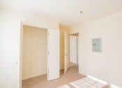 Thumbnail 15 of 28 - a bedroom with a closet and a door to a closet