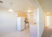Thumbnail 3 of 28 - a renovated kitchen with white appliances and white cabinets
