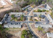 Thumbnail 8 of 21 - an aerial view of a neighborhood of houses and a road at Pendleton Townhomes Apartments, Durham, NC