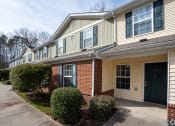 Thumbnail 5 of 21 - an apartment building with a sidewalk in front of it at Pendleton Townhomes Apartments, North Carolina 27703