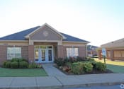Thumbnail 2 of 19 - the front of a brick house with a sidewalk in front