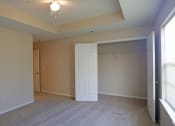 Thumbnail 17 of 19 - a bedroom with a closet and a white door