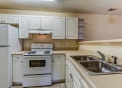 Thumbnail 11 of 15 - kitchen with white cabinets