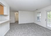 Thumbnail 8 of 26 - A room with white walls and a grey carpet.