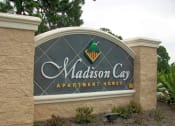 Thumbnail 1 of 7 - a sign at the entrance apartment lodges