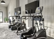 Thumbnail 7 of 17 - Gym with treadmills and elliptical machines at Dwell at Greenridge, North Charleston