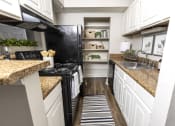 Thumbnail 14 of 17 - Modern Kitchen With Stainless Steel Appliances And Double Door Refrigerators at Dwell at Greenridge, North Charleston, SC, South Carolina