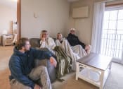 Thumbnail 16 of 32 - people sitting on a couch in a living room at Boulder Ridge, Duluth, 55811