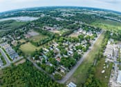 Thumbnail 11 of 16 - an aerial view of a neighborhood with houses and trees