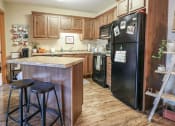 Thumbnail 7 of 32 - a kitchen with a counter top and a refrigerator at Boulder Ridge, Duluth, 55811