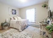Thumbnail 6 of 32 - a bedroom with a bed and a tv at Boulder Ridge, Duluth, 55811
