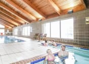 Thumbnail 28 of 32 - a group of people in a swimming pool at Boulder Ridge, Minnesota
