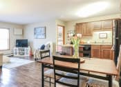 Thumbnail 1 of 32 - a living room and kitchen with a wooden table at Boulder Ridge, Duluth, MN 55811