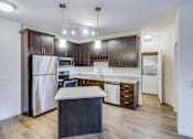 Thumbnail 16 of 35 - a kitchen with stainless steel appliances and a marble counter top at Arbor Ridge, Forest Lake, 55025