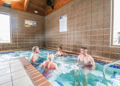 Thumbnail 26 of 31 - a group of people in a swimming pool at Summit Ridge, Duluth, MN, 55811