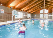 Thumbnail 25 of 31 - a group of people playing in a swimming pool at Summit Ridge, Duluth