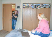 Thumbnail 22 of 31 - two women sitting on a bed in a room with a laptop at Summit Ridge, Duluth, Minnesota