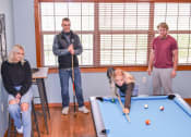 Thumbnail 16 of 31 - a group of people standing around a pool table at Summit Ridge, Duluth, MN, 55811