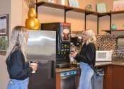 Thumbnail 18 of 31 - two women standing in a kitchen drinking coffee at Summit Ridge, Duluth, MN