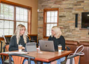 Thumbnail 11 of 31 - two women sitting at a table in a restaurant at Summit Ridge, Duluth