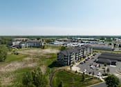 Thumbnail 45 of 67 - an aerial view of an apartment complex in a city  at Timber Ridge, Forest Lake, MN