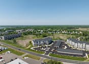 Thumbnail 48 of 67 - an aerial view of a city with buildings and roads  at Timber Ridge, Minnesota, 55025