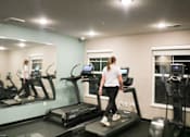 Thumbnail 64 of 67 - a woman running on a treadmill in a gym  at Timber Ridge, Forest Lake, MN, 55025