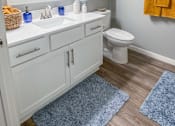 Thumbnail 32 of 67 - a bathroom with a toilet and a sink and a mirror  at Timber Ridge, Minnesota, 55025
