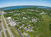 Thumbnail 4 of 16 - an aerial view of a city with a lake in the background