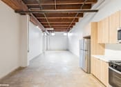 Thumbnail 9 of 57 - A spacious kitchen with wooden cabinets and stainless steel appliances.
