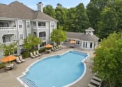Thumbnail 1 of 20 - an aerial view of a swimming pool with umbrellas in front of a hotel
