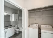 Thumbnail 4 of 25 - a white kitchen with white appliances and white cabinets