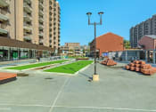 Thumbnail 37 of 82 - Enjoy games in The Plaza like bocce ball at Trillium Apartments, Virginia, 22031